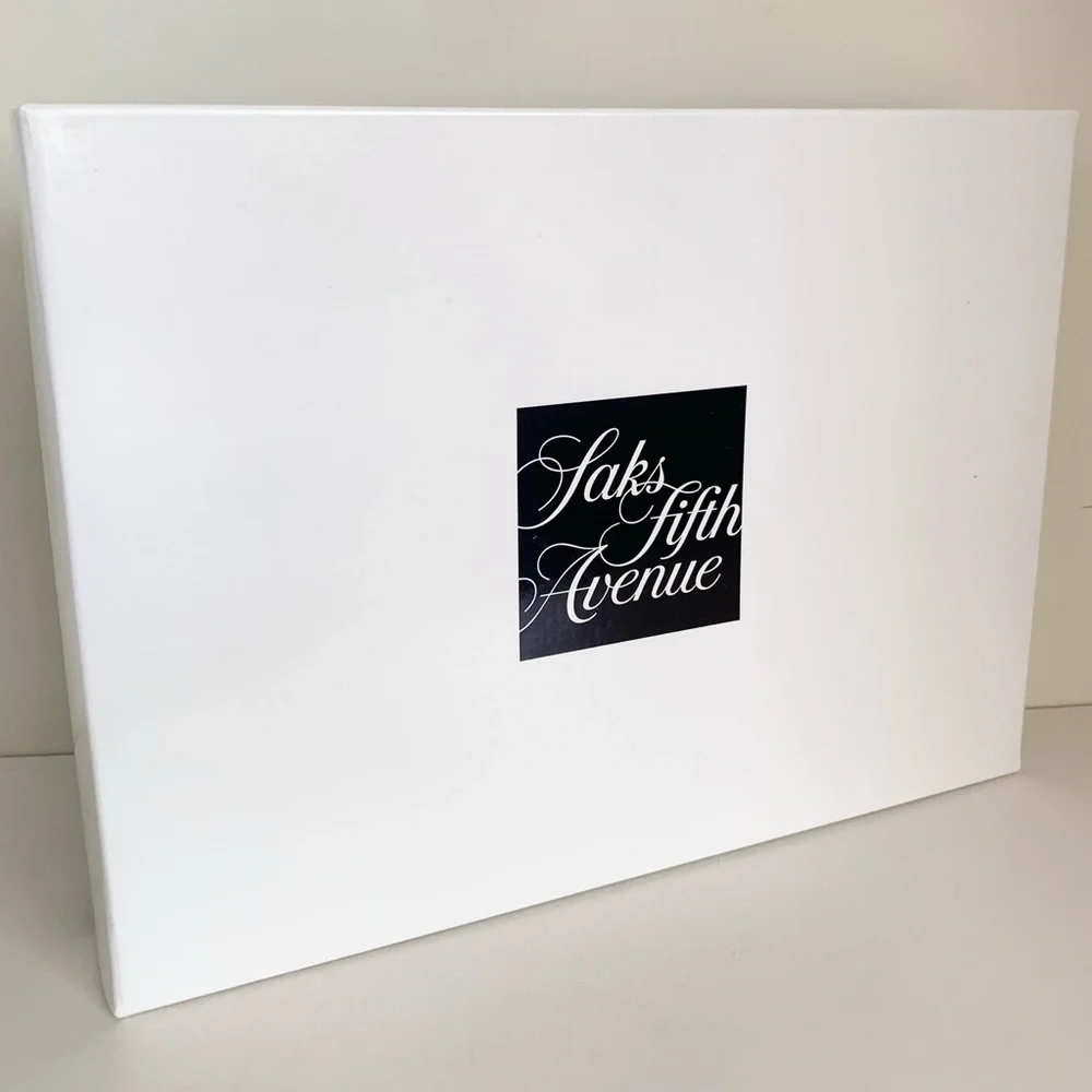 Hold Saks Fifth Avenue gift boxes